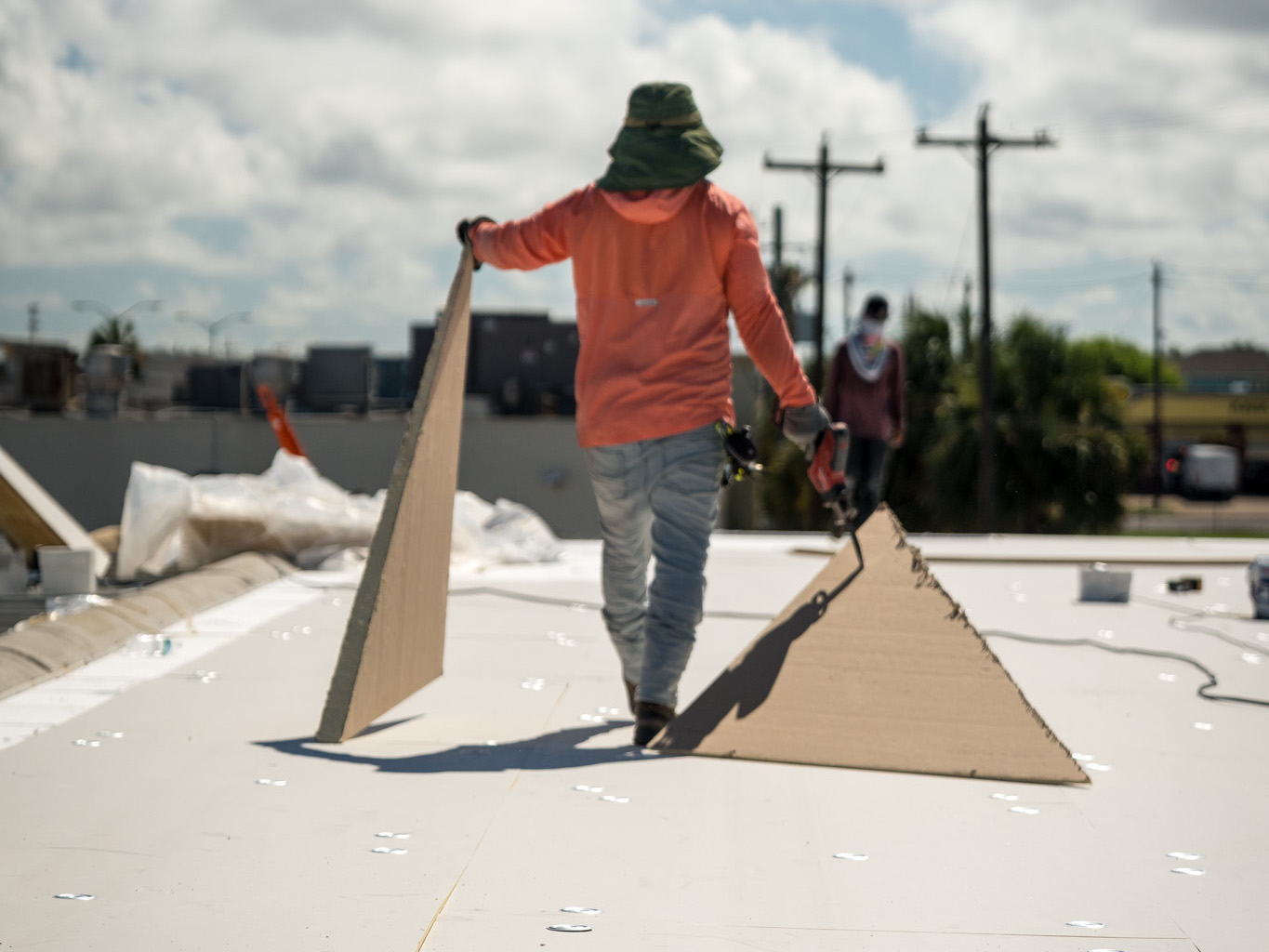 Roofer replacing a roof in the Houston Metro Area, TX.