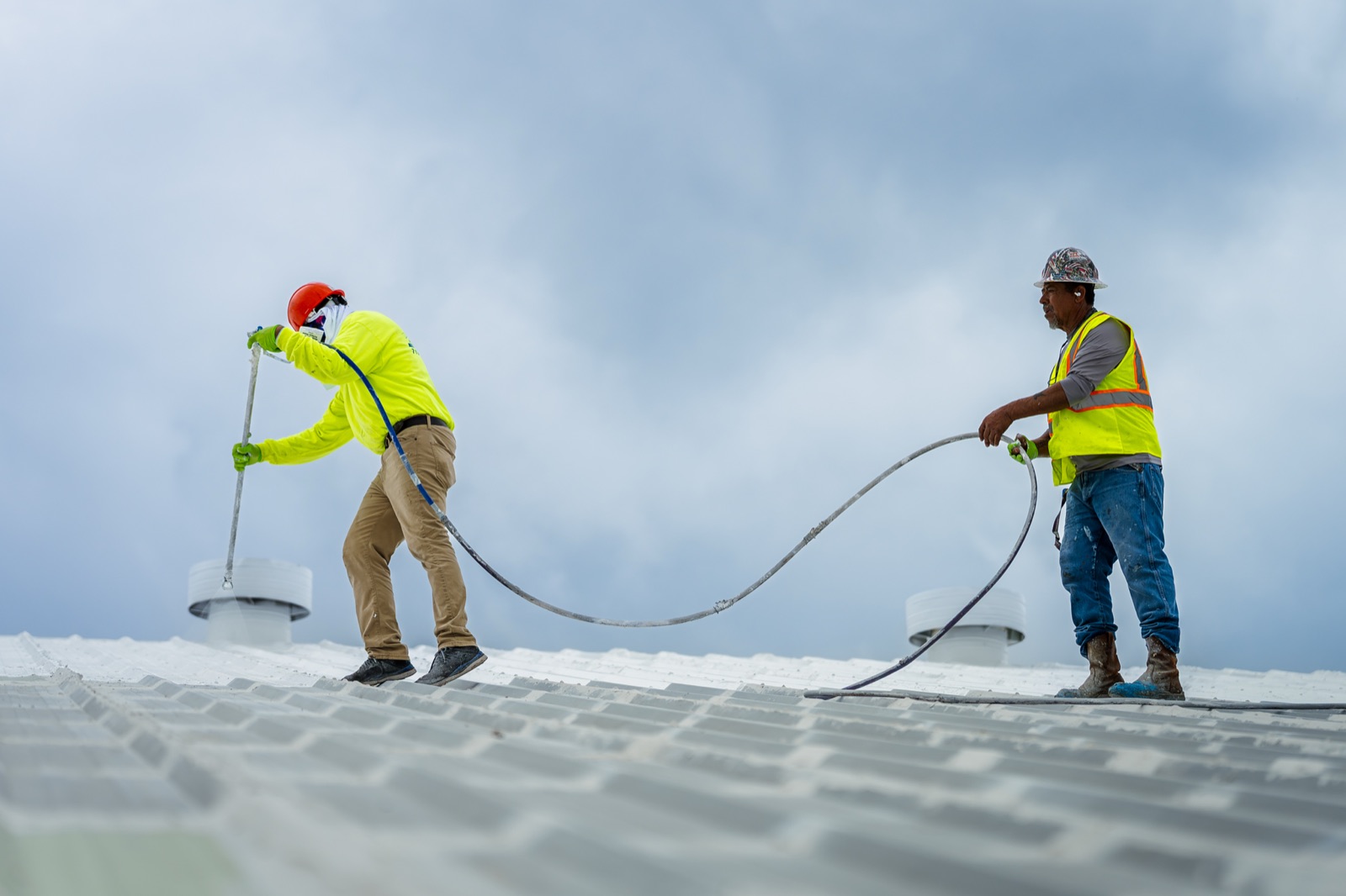 Coating carried around the roof penetrations and curbs